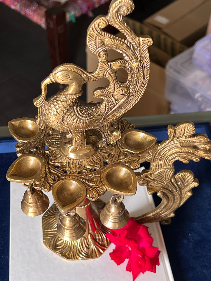 Antique Brass Peacock Bell with Diya - Ethereal Beauty and Illumination